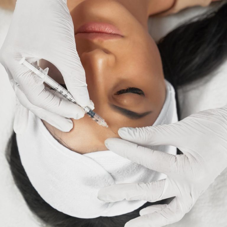 Cosmetic botox injection in female forehead